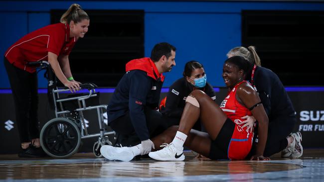 NSW Swifts Sam Wallace is assisted off the court following her knee injury in the opening round clash with Giants. Photo: Narelle Spangher, Netball NSW.