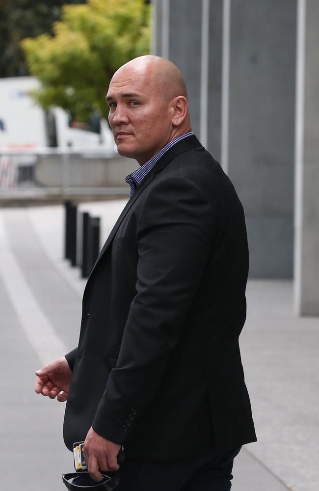 Christopher Barrett leaves the Brisbane District Court.