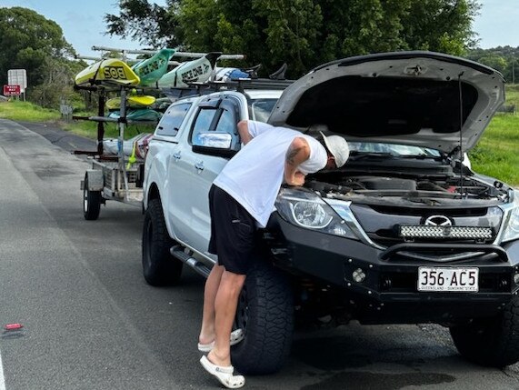 Ben Carberry trying to fix his ute.