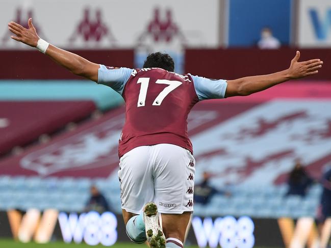 BIRMINGHAM, ENGLAND - JULY 21: Trezeguet of Aston Villa celebrates after he scores his sides 1st goal during the Premier League match between Aston Villa and Arsenal FC at Villa Park on July 21, 2020 in Birmingham, England. Football Stadiums around Europe remain empty due to the Coronavirus Pandemic as Government social distancing laws prohibit fans inside venues resulting in all fixtures being played behind closed doors. (Photo by Shaun Botterill/Getty Images)