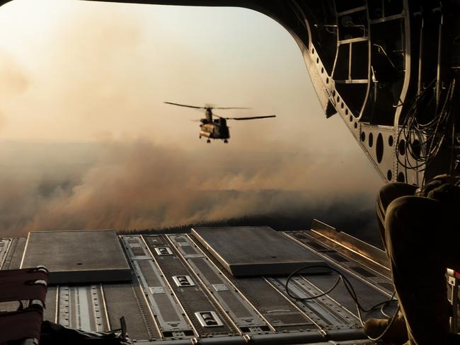 Australian Army CH-47 Chinooks from the 5th Aviation Regiment,return from delivering hay bales to remote bushfire effected farms on Kangaroo Island during OP Bushfire Assist.  *** Local Caption *** CH-47 Chinook helicopters from the Australian Army's 5th Aviation Regiment have been helping to quickly pick up and drop off hay to feed livestock at hard to reach properties on Kangaroo Island as part of Operation Bushfire Assist 2019-2020.