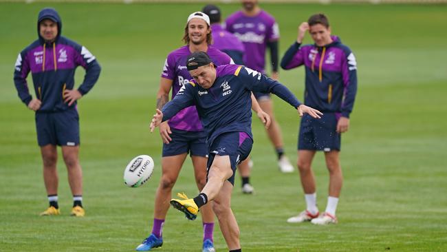 Storm star Cameron Munster kicks a ball during training at Albury Sports Ground. Picture: AAP Image/Scott Barbour