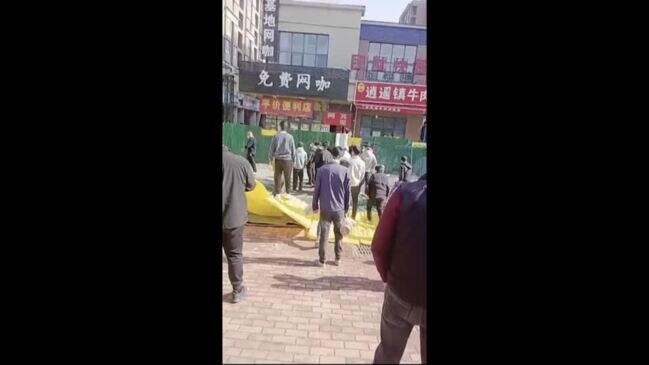 Stick-wielding men protest at China iPhone plant | news.com.au ...