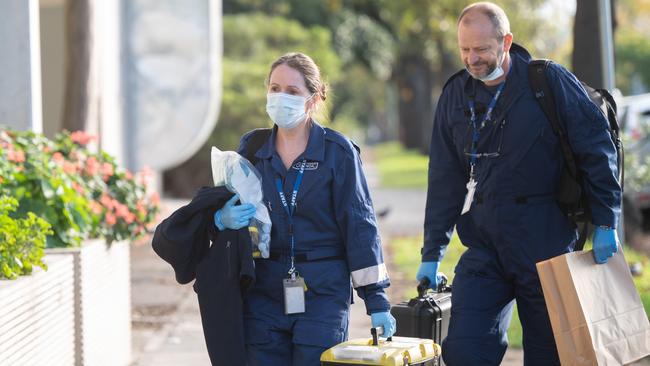 Homicide Squad detectives and forensics at the scene. Picture: Tony Gough