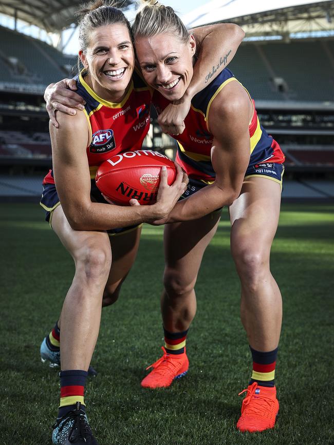 Chelsea Randall with fellow Crows co-captain Erin Phillips. Both players have re-signed with Adelaide for the 2020 season. Picture: Sarah Reed