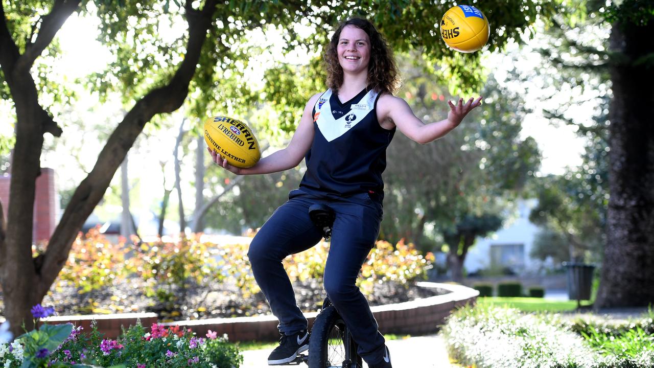 Quirky young footballer Ebony O'Dea holds the world record for the longest unicycle platform long jump. Picture: Tricia Watkinson