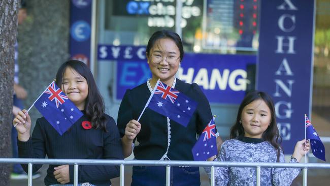 Alice, Amy and Angela Jean among thousands lining Adelaide St in Brisbane for the 2023 ANZAC Day March.Picture: NCA NewsWire / Glenn Campbell