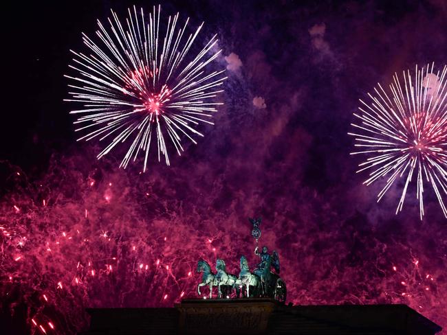 Fireworks explode behind the quadriga of Berlin's landmark Brandenburg Gate to usher in the New Year. Picture: AFP