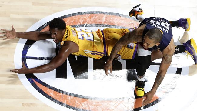 Jerome Randle and Casper Ware tangle during the Kings’ win over Adelaide. Picture: Sarah Reed.