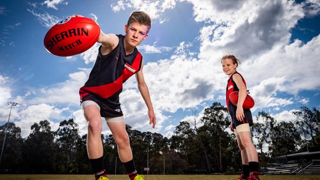 Junior footy players will be banned from high-fiving in sweeping safety measures to combat COVID-19. Picture: Jake Nowakowski