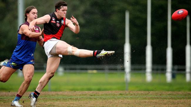 NFL: Eltham’s Daniel Horsfield kicks long. Picture: Hamish Blair