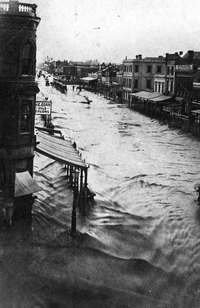 This photograph was taken of flash flooding in Elizabeth St in 1862. Elizabeth Street has been inundated many times over the years. Picture: HWT Library.