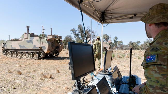 Two autonomous Australian Army M113 AS4 armoured vehicles conducted fire and manoeuvre alongside crewed vehicles, UAS and ground robots at the Majura Training Area, ACT. Picture: Supplied