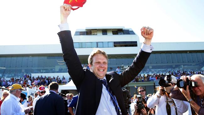 Bjorn Baker celebrating Unencumbered in the 2YO Magic Millions Classic in 2014. Picture: Adam Head
