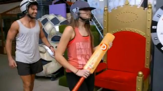 Here, Heather enjoys Sam’s helmet and has a bat.