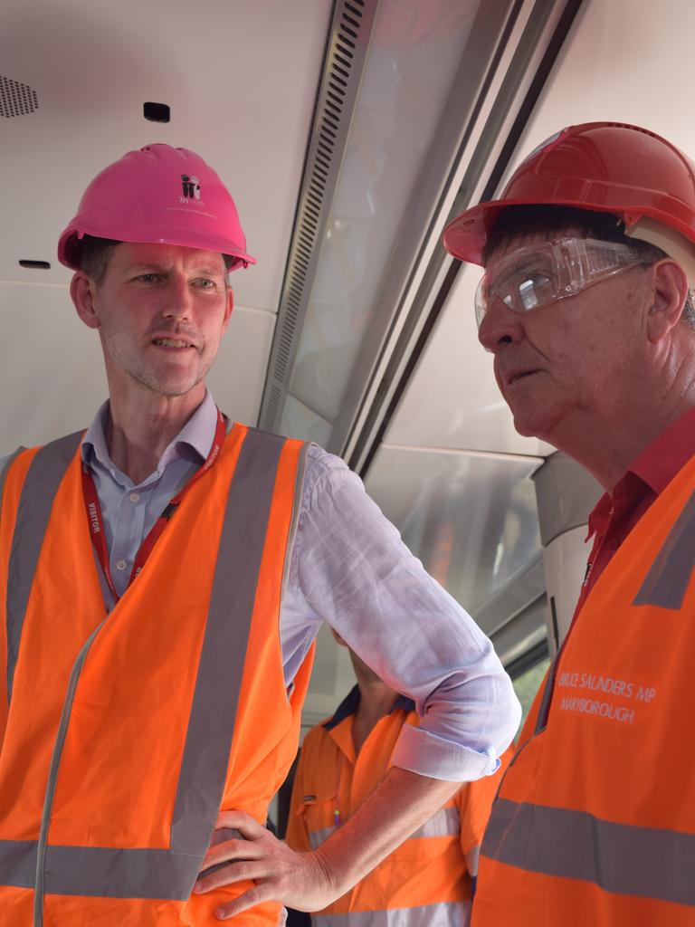 Transport Minster Mark Bailey with Maryborough member Bruce Saunders (right) in the first of 76 NGR trains to be repaired at Downer EDI.