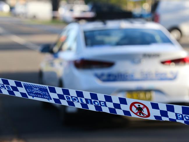 SYDNEY, AUSTRALIA - NEWSWIRE PHOTOS June 14 2022: A general stock image of a Police tape in front of a Police car in Sydney. Picture NCA Newswire/ Gaye Gerard.