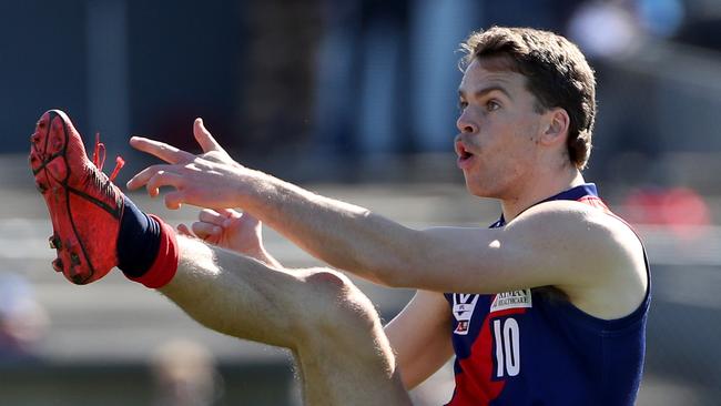 Mitch Podhajski takes a kick for Coburg, which will be part of the new-look VFL.