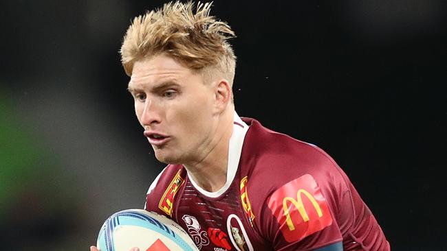 MELBOURNE, AUSTRALIA - MARCH 25: Tate McDermott of the Reds runs with the ball during the round five Super Rugby Pacific match between Melbourne Rebels and Queensland Reds at AAMI Park, on March 25, 2023, in Melbourne, Australia. (Photo by Kelly Defina/Getty Images)