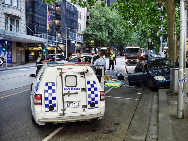 Police on Bourke St after a man was dramatically arrested between Elizabeth and Queen streets. Picture: Jason Edwards