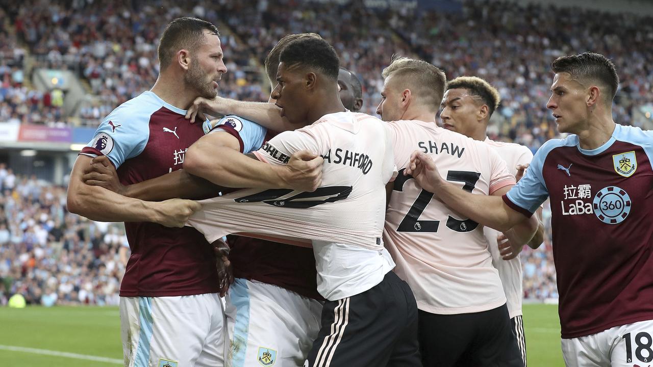 Burnley's Phillip Bardsley, left, and Manchester United's Marcus Rashford clash. Picture: PA via AP