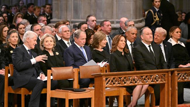 From L to R, first row, US Vice President Kamala Harris and Second Gentleman Doug Emhoff, second row, former President Bill Clinton, former Secretary of State Hillary Clinton, former President George W. Bush, his wife Laura Bush, former President Barack Obama, President-elect Donald Trump and his wife Melania Trump attend the State Funeral Service for former US President Jimmy Carter.