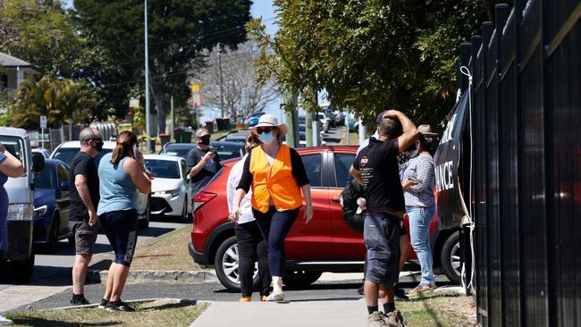 Parents and staff at the gates trying to organise collection in kids at St Thomas More College in Sunnybank. Picture: NCA NewsWire / Sarah Marshall