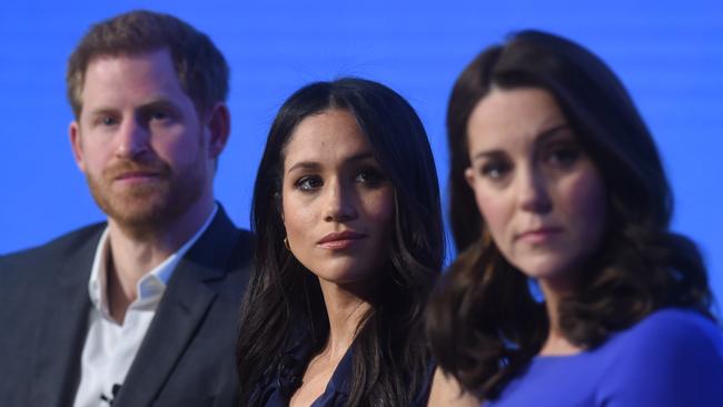 Prince Harry, Meghan Markle, and Kate Middleton. (Photo by Eddie Mulholland - WPA Pool/Getty Images)