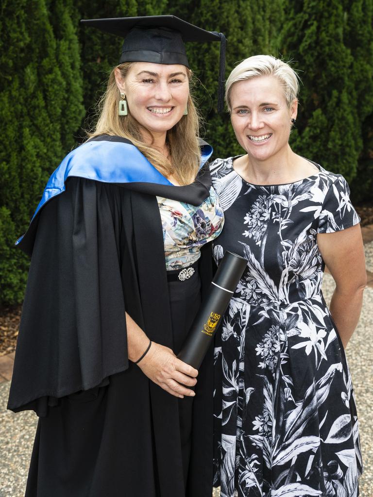 Bachelor of Psychology (Honours) graduate Cherylin Buttle with Joaleen Headridge at the UniSQ graduation ceremony at Empire Theatres, Tuesday, December 13, 2022. Picture: Kevin Farmer