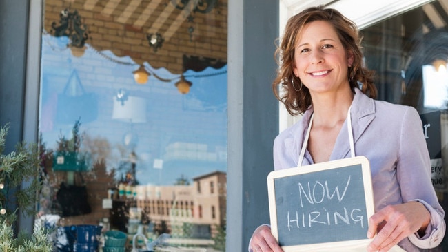 istock small business hiring sign woman