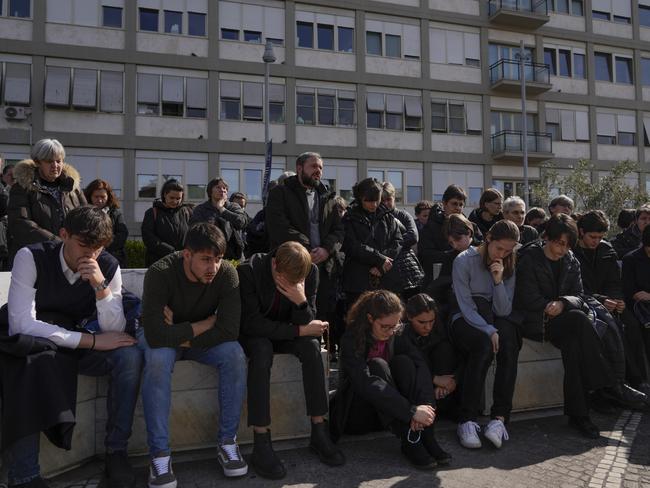 People pray outside the Agostino Gemelli Polyclinic in Rome, where Pope Francis is hospitalised. Picture: AP