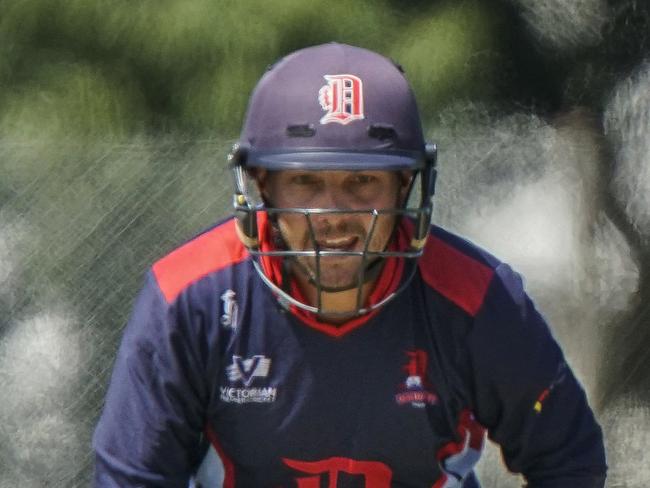 Vic Premier Cricket: Dandenong v Melbourne. Dandenong keeper Jacques Augustin and Melbourne batsman Matthew Brown. Picture: Valeriu Campan