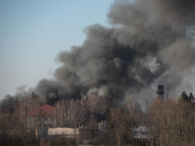 Smoke is seen above buildings close to the airport in Lviv, Ukraine. Picture: Getty Images