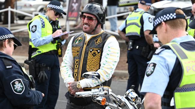 ACT Police stop and talk with a smiling Allan Meehan, the national president of the Comanchero OMCG. Picture: NewsWire