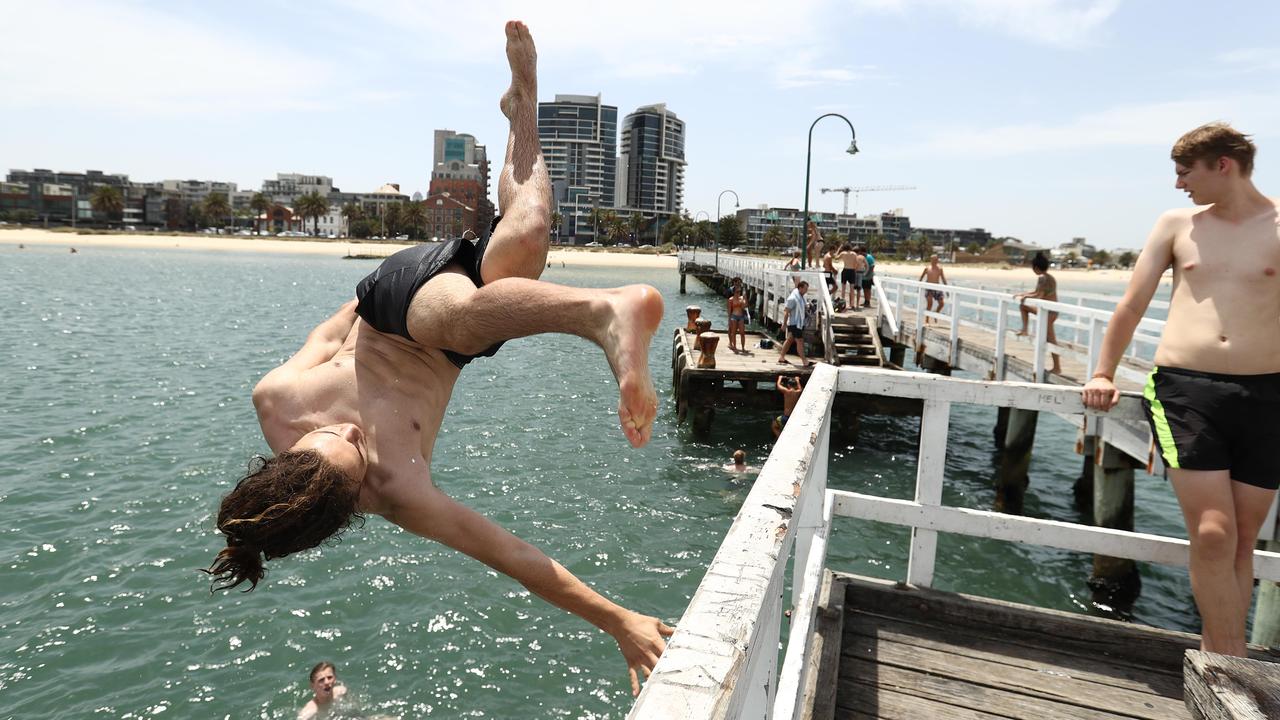 Youths jump off Lagoon Pier at Port Melbourne Beach on January 25. Picture: Robert Cianflone/Getty Images