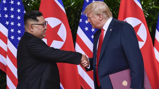 North Korea leader Kim Jong Un and U.S. President Donald Trump shake hands at the conclusion of their meetings at the Capella resort on Sentosa Island Tuesday, June 12, 2018 in Singapore. (AP Photo/Susan Walsh, Pool)