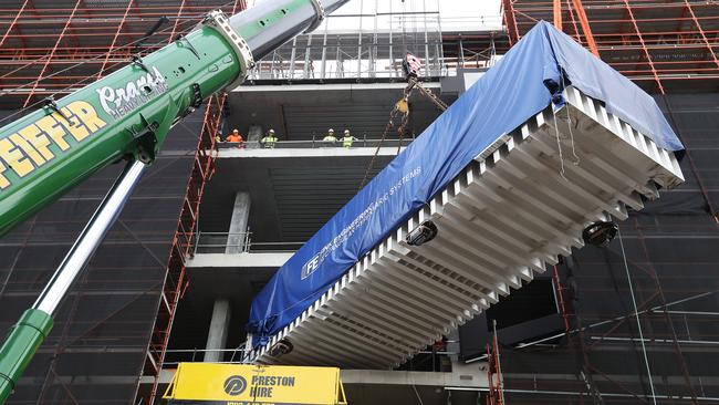 The new hyperbaric chamber is lifted into the Royal Hobart Hospital as part of the redevelopment. Picture: NIKKI DAVIS-JONES