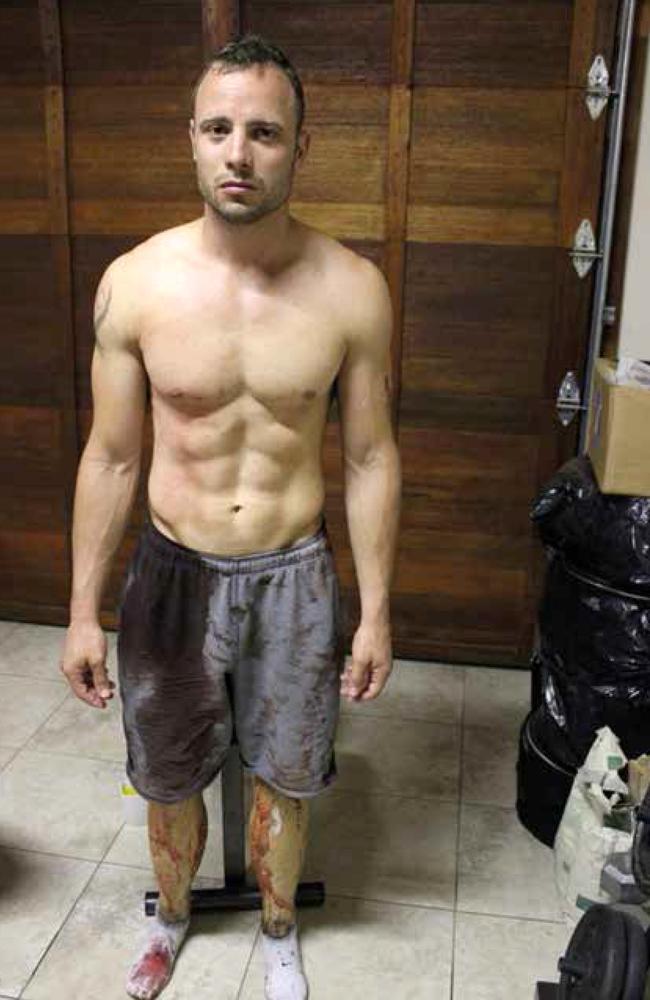 Pistorius in his garage just hours after killing Reeva. He had already washed blood off his hands and chest.