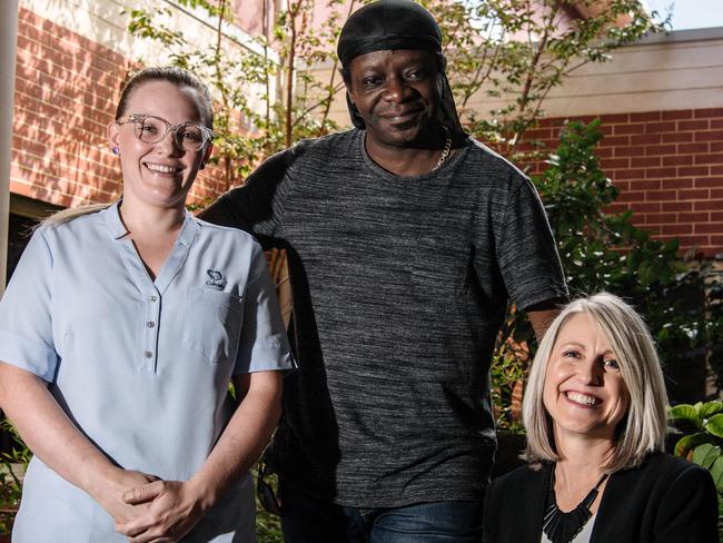 Nurse Amy Williams, Stephen K Amos and Cathy Murphy from the Mary Potter Foundation at the Mary Potter Hospice in North Adelaide. Amos has surprised local charity the Mary Potter Foundation by raising money for the charity at all of his Fringe shows this year on Wednesday, March 13, 2019. (Morgan Sette/ The Advertiser)