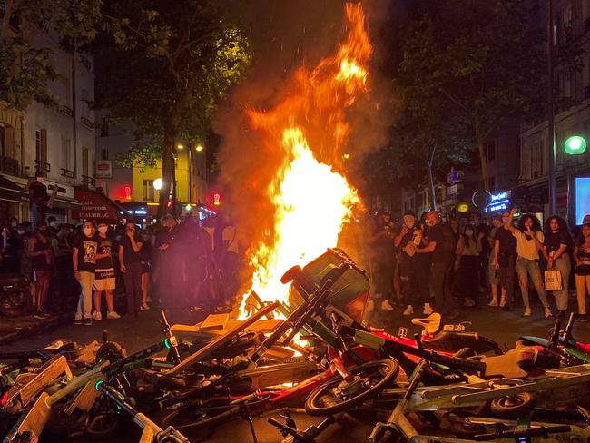 Protesters burn bins, shared scooters and bicycles in Paris. Picture: AFP