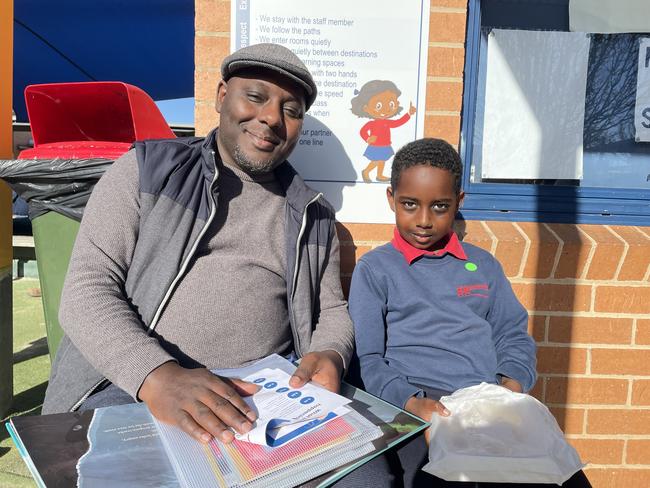 Albanvale Primary School: Haile (left) and Adom (right) enjoy a book together as part of Book Week at Albanvale Primary School. Picture: Athos Sirianos