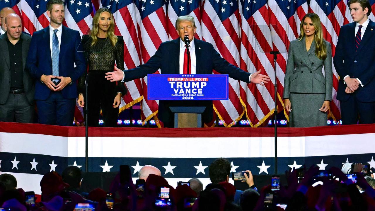 Donald Trump on stage with family and friends as he addresses supporters. Picture: Jim Watson/AFP