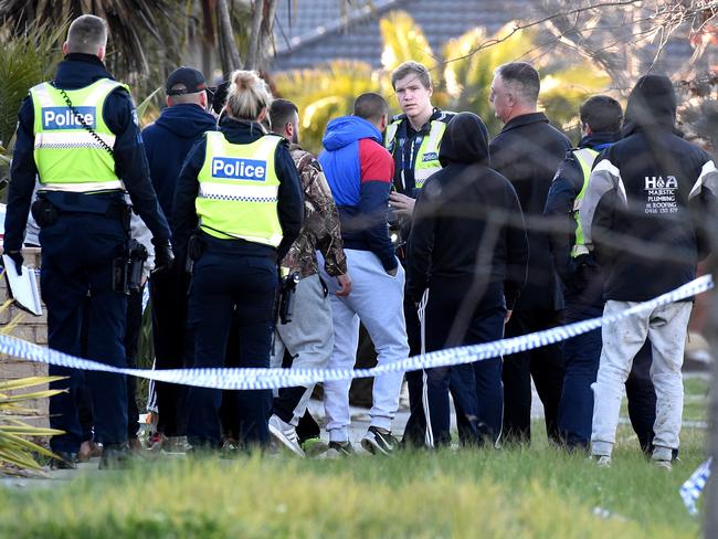 A large group of men who walked into the crime scene in Roxburgh Park.