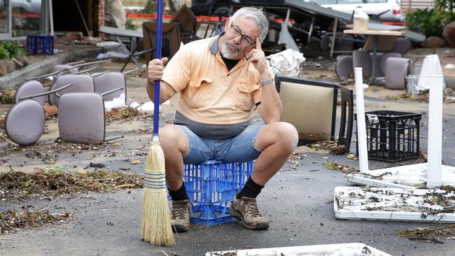 Clan’s maintenance worker Kohn Masia contemplates where to start the clean-up this morning. Picture: Mark Scott