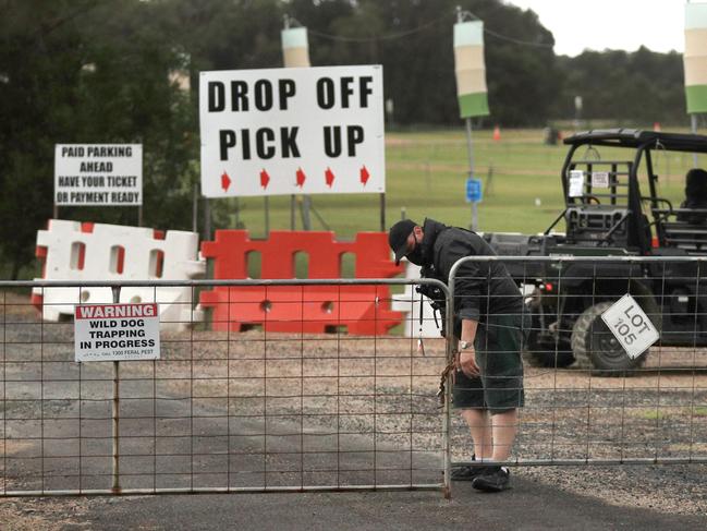 BYRON BAY , AUSTRALIA - NewsWire Photos March 31, 2021: Byron Bay Blues Festival front gates are locked shut with a big metal chain by Event Security after ticket holders were told the event had been cancelled at the last minute due to current Covid-19 outbreaks at Byron Bay.Picture: NCA NewsWire / Scott Powick