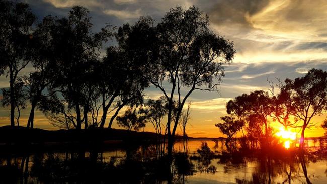 Two people in a car are missing and 18 people in a bus have been rescued after becoming trapped by flooding in the Tanami Desert. This picture shows rare flooding in the Tanami Desert in 2017. Picture: Supplied
