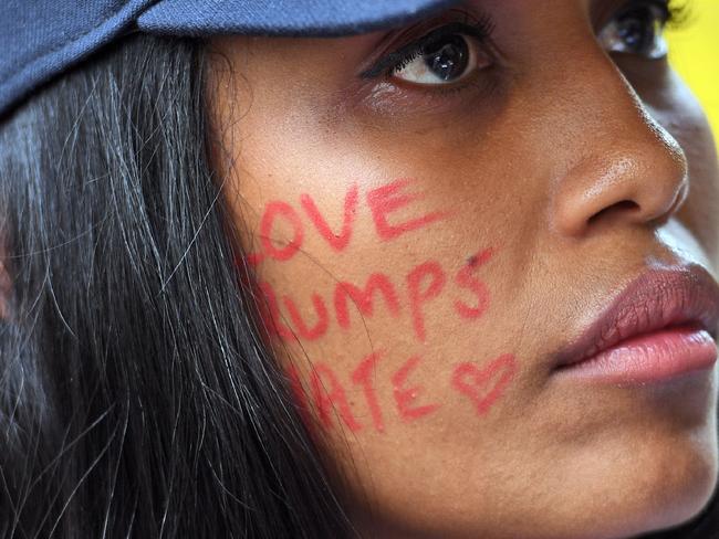 The demonstrators said Australia could help persuade Mr Trump to drop his ‘illegal, inhumane’ ban. Picture: Dean Lewins/AAP