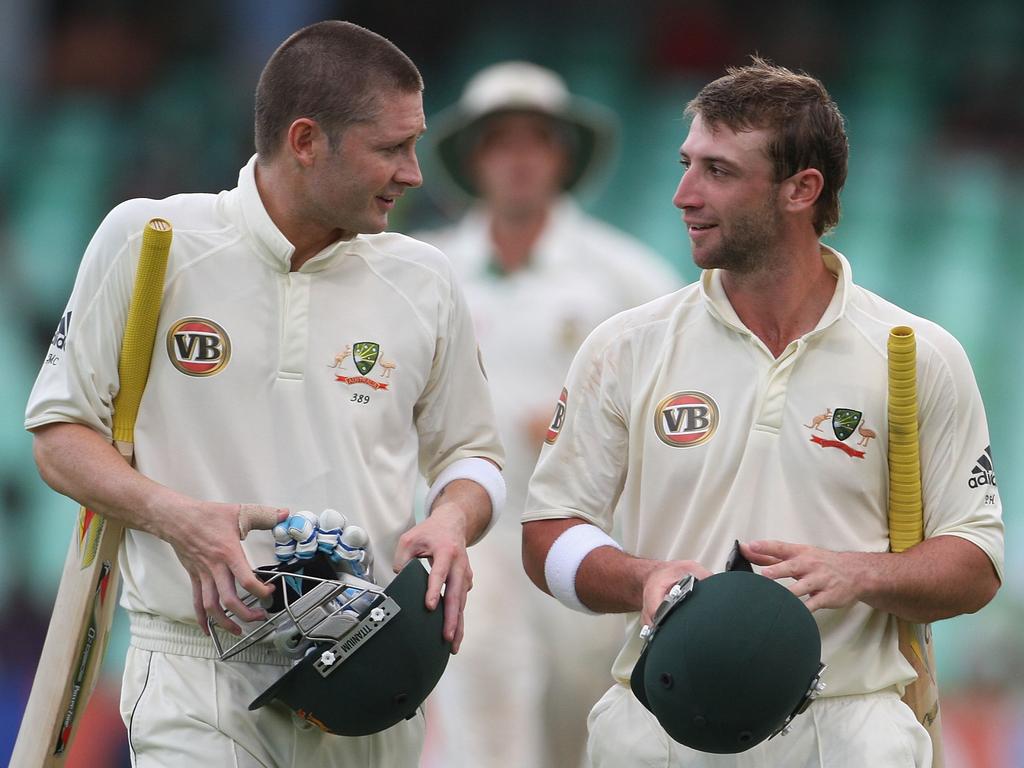 Michael Clarke alongside Phillip Hughes. Picture: Hamish Blair/Getty Images