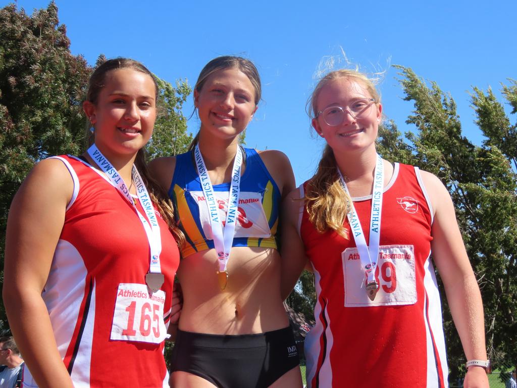 The under-16 girls shot put podium. Maighan Arnold (bronze), Bailey Van Den Broek (gold) and Arielle Cannell (silver).