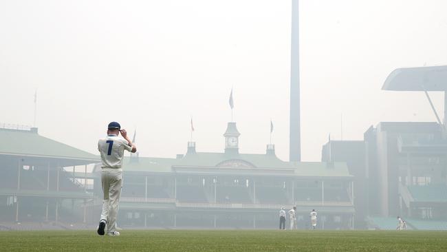 The SCG takes on an eerie feel as smoke takes over. Picture. Phil Hillyard